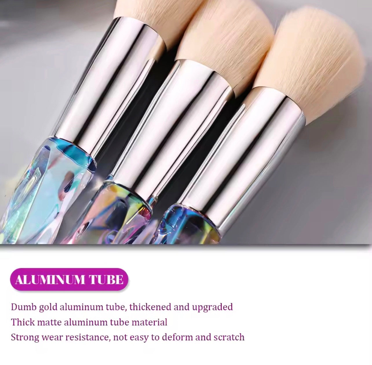 10-piece vegan makeup brush set with iridescent, crystal-style handles, contained in a clear, holographic carrying case.