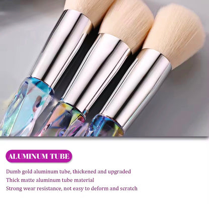 10-piece vegan makeup brush set with iridescent, crystal-style handles, contained in a clear, holographic carrying case.