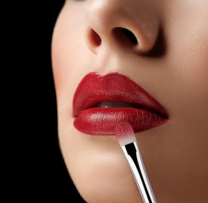 10-piece vegan makeup brush set with iridescent, crystal-style handles, contained in a clear, holographic carrying case.